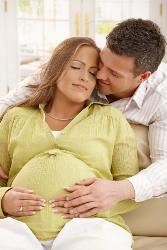 Man embracing pregnant woman